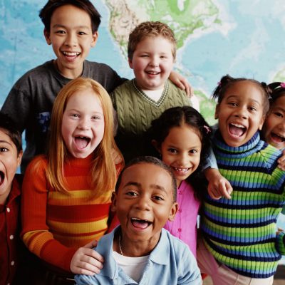School children (8-10) in front of map